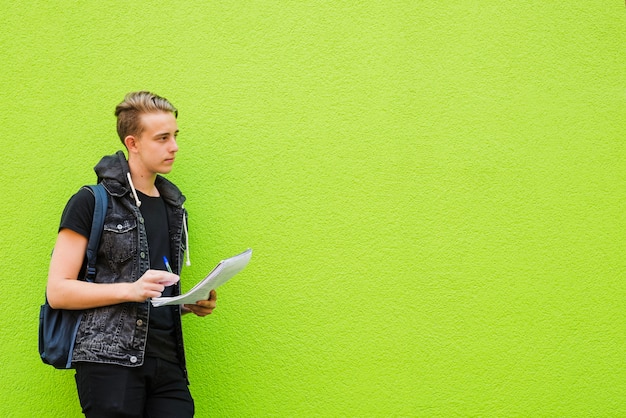 Young boy with notepad