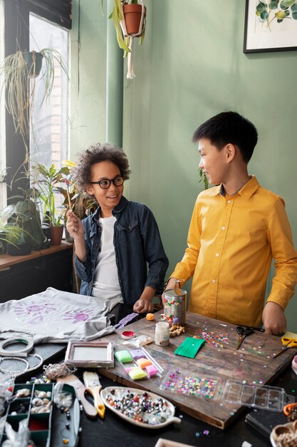 Young boys making diy project from upcycled materials