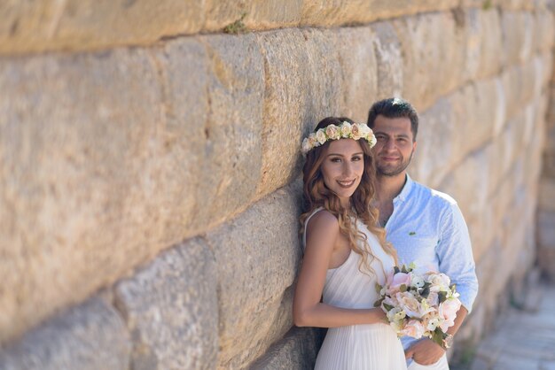 Young bride and groom in wedding dress, and causal wedding