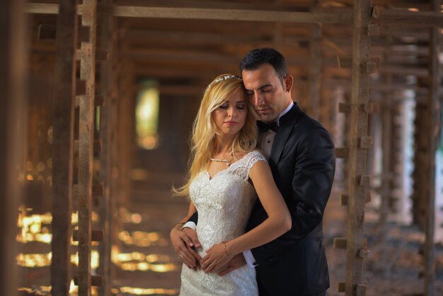 Young bride and groom in wedding dress outdoor