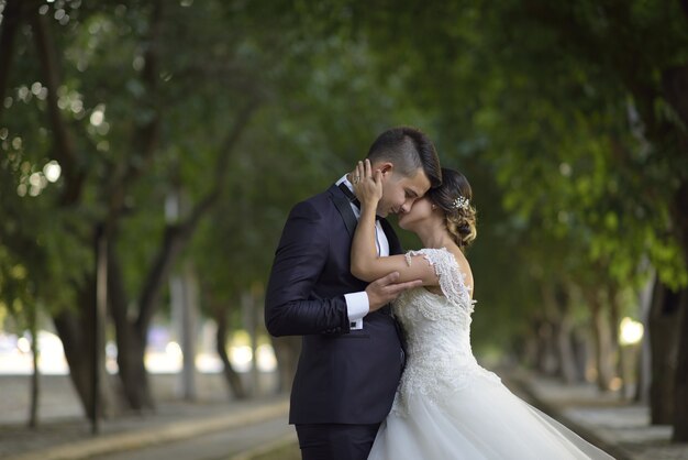 Young bride and groom in wedding dress