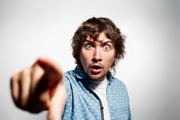 Young brunet man wearing blue shirt