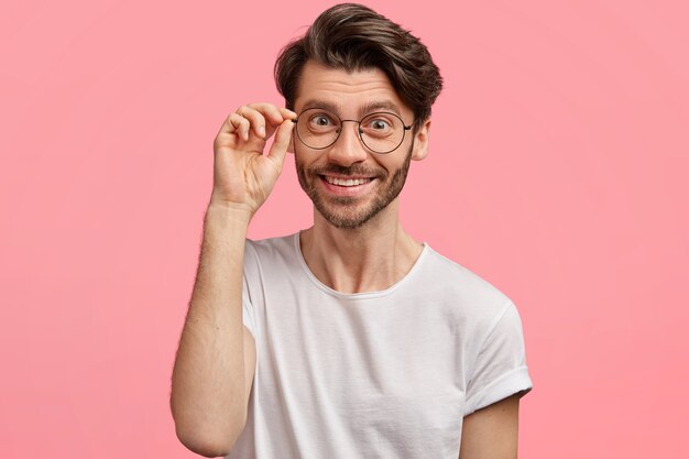 Young brunet man wearing trendy eyeglasses