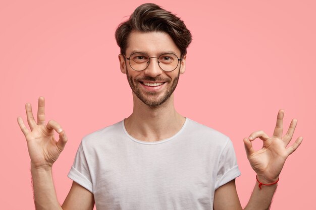 Young brunet man wearing trendy eyeglasses