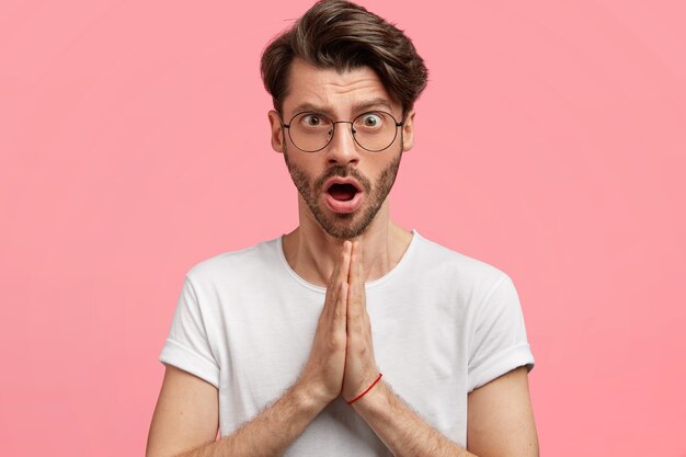 Young brunet man wearing trendy eyeglasses