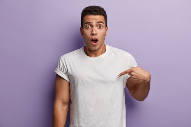 Young brunet man wearing white T-shirt