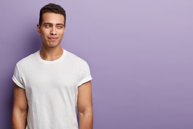 Young brunet man wearing white T-shirt