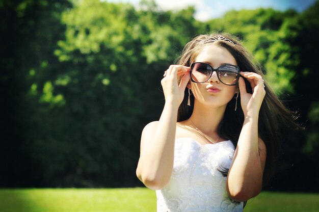 Young brunette bride with glasses