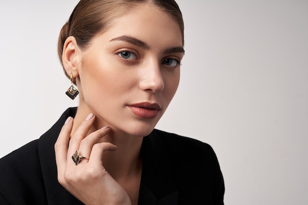 Young brunette model demonstrating jewelry