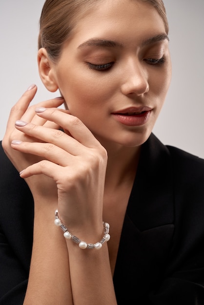 Young brunette model demonstrating jewelry