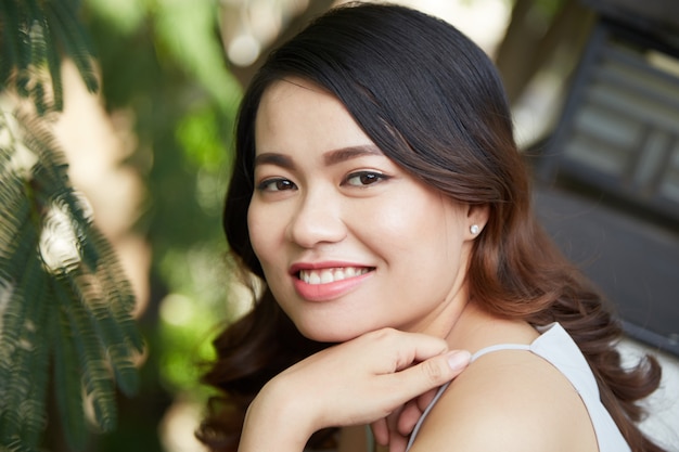 Young brunette smiling at camera