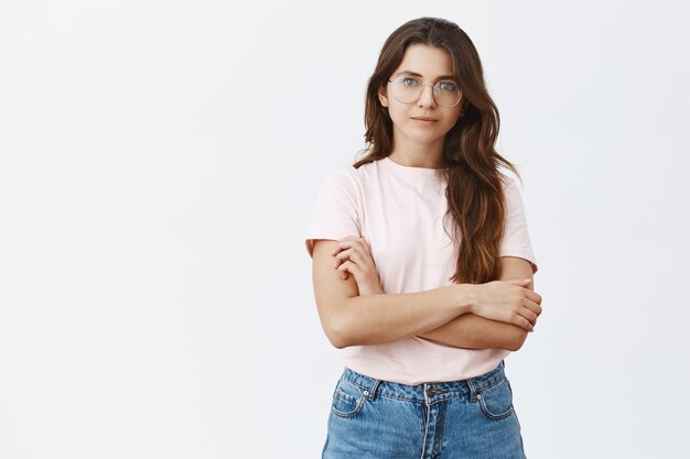 young brunette with glasses posing