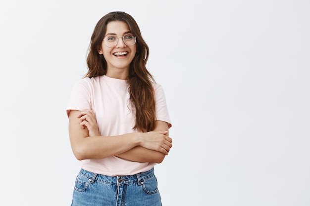 young brunette with glasses posing