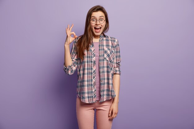 Young brunette woman in colorful clothes