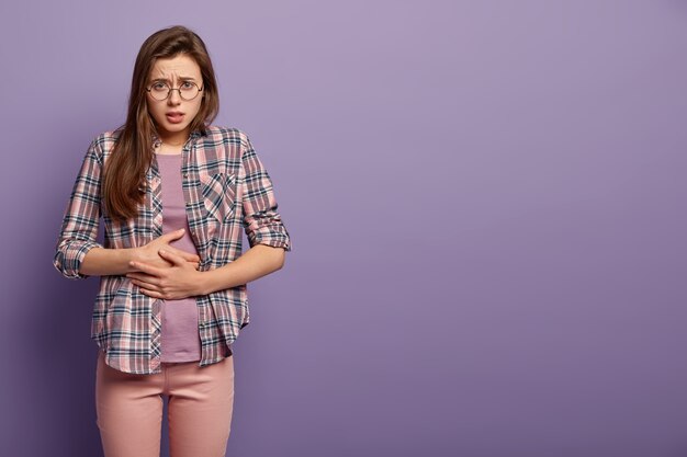 Young brunette woman in colorful clothes