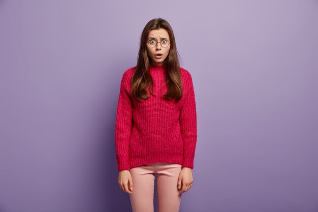 Young brunette woman in cozy winter clothes