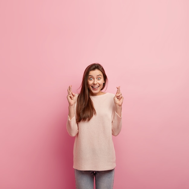 Young brunette woman in jeans and sweater