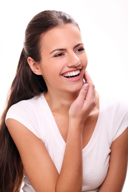 Young brunette woman laughing