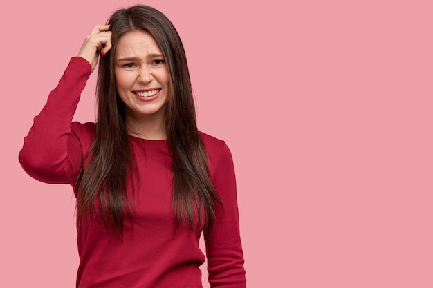 Free photo young brunette woman in red blouse