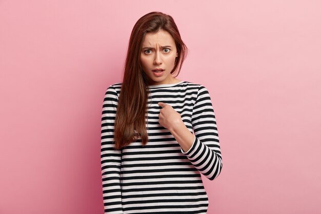 Young brunette woman in striped blouse