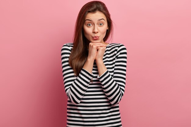 Young brunette woman in striped shirt