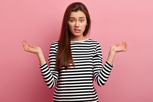 Young brunette woman in striped shirt