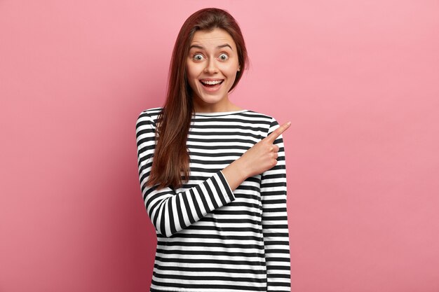 Young brunette woman in striped shirt