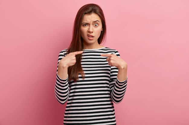 Young brunette woman in striped shirt