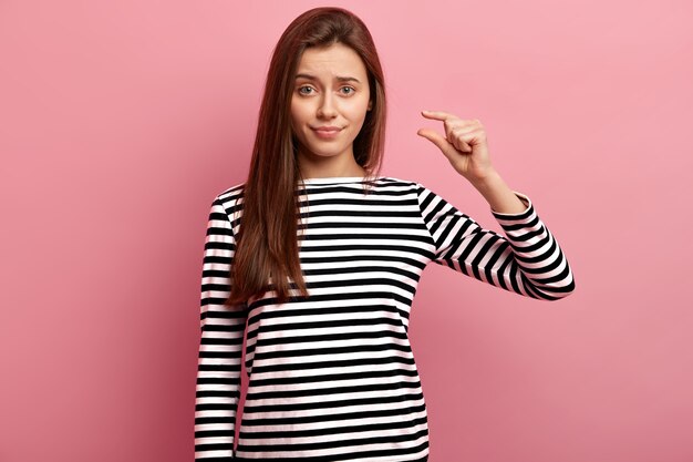 Young brunette woman in striped shirt