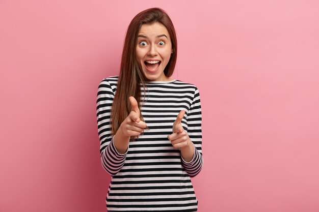 Young brunette woman in striped shirt