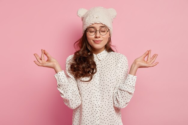 Young brunette woman wearing funny hat