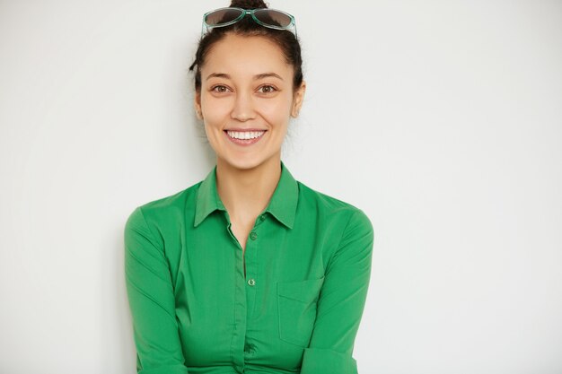 Young brunette woman wearing green shirt