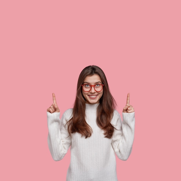 Young brunette woman wearing red eyeglasses