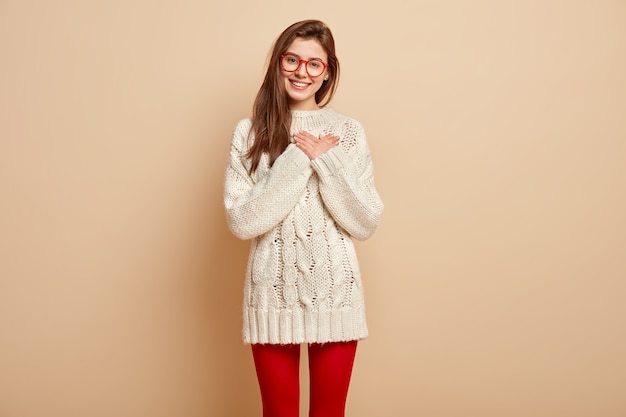 Young brunette woman wearing red glasses