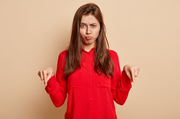 Young brunette woman wearing red shirt