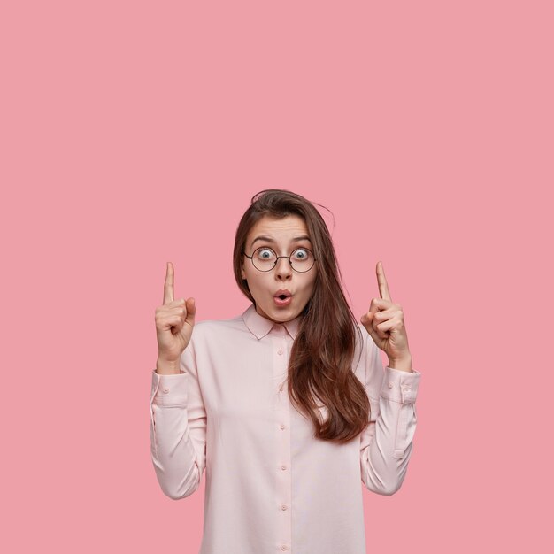 Young brunette woman wearing white shirt