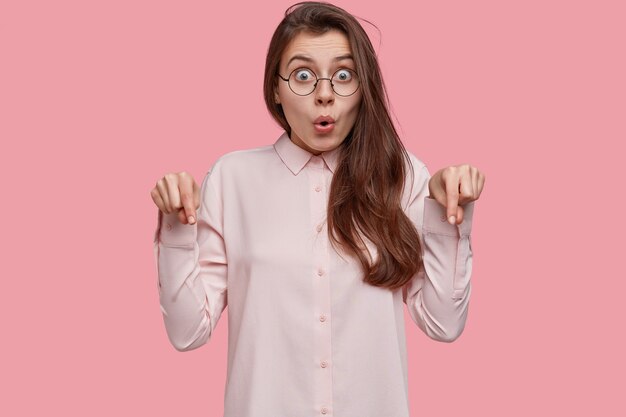 Young brunette woman wearing white shirt