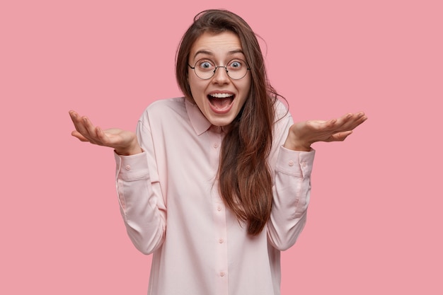 Young brunette woman wearing white shirt