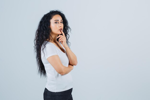 Young brunette woman in a white t-shirt