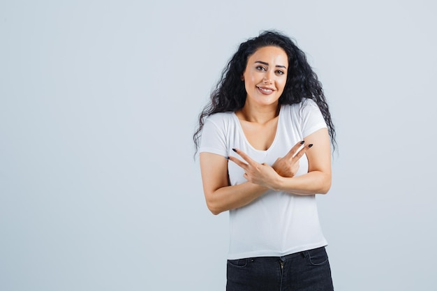 Young brunette woman in a white t-shirt