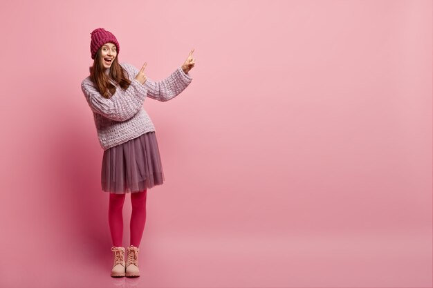 Young brunette woman in winter clothes