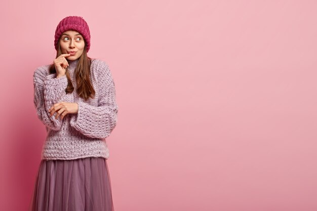 Young brunette woman in winter clothes