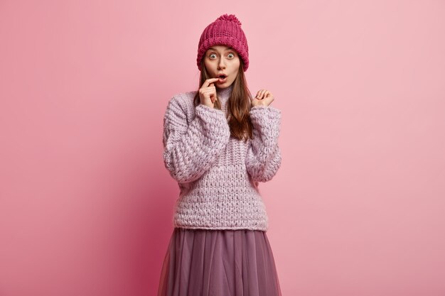 Young brunette woman in winter clothes