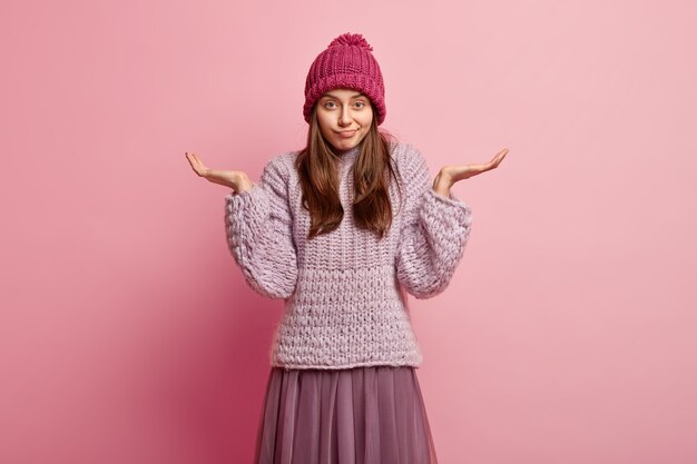 Young brunette woman in winter clothes