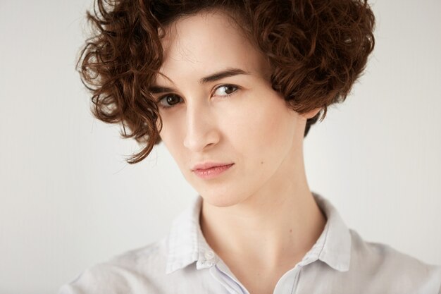 Young brunette woman with curly hair