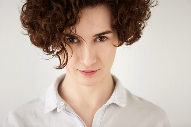 Young brunette woman with curly hair