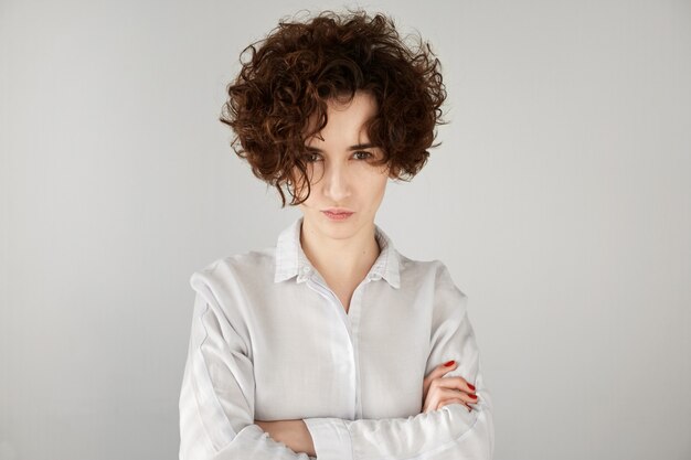 Young brunette woman with curly hair