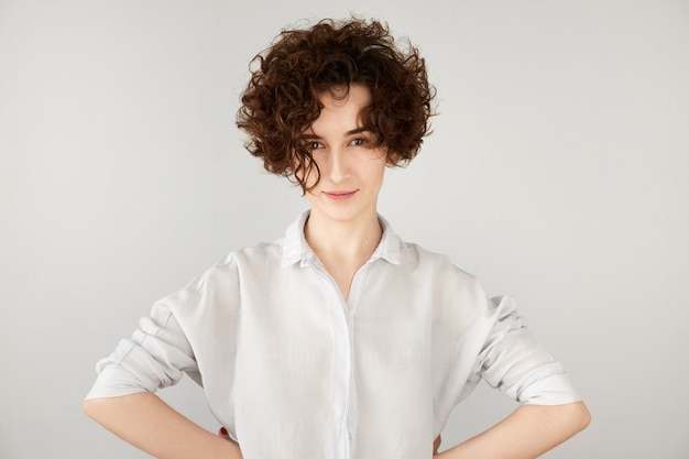 Young brunette woman with curly hair