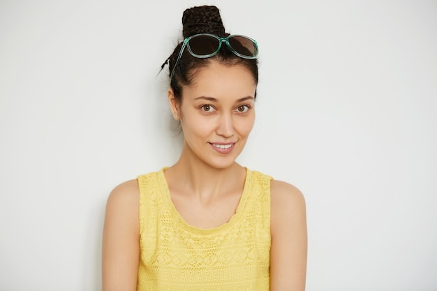 Young brunette woman with hair in a bun