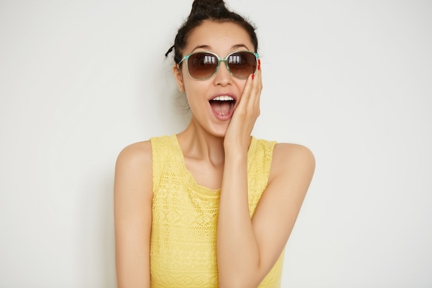 Young brunette woman with hair in a bun